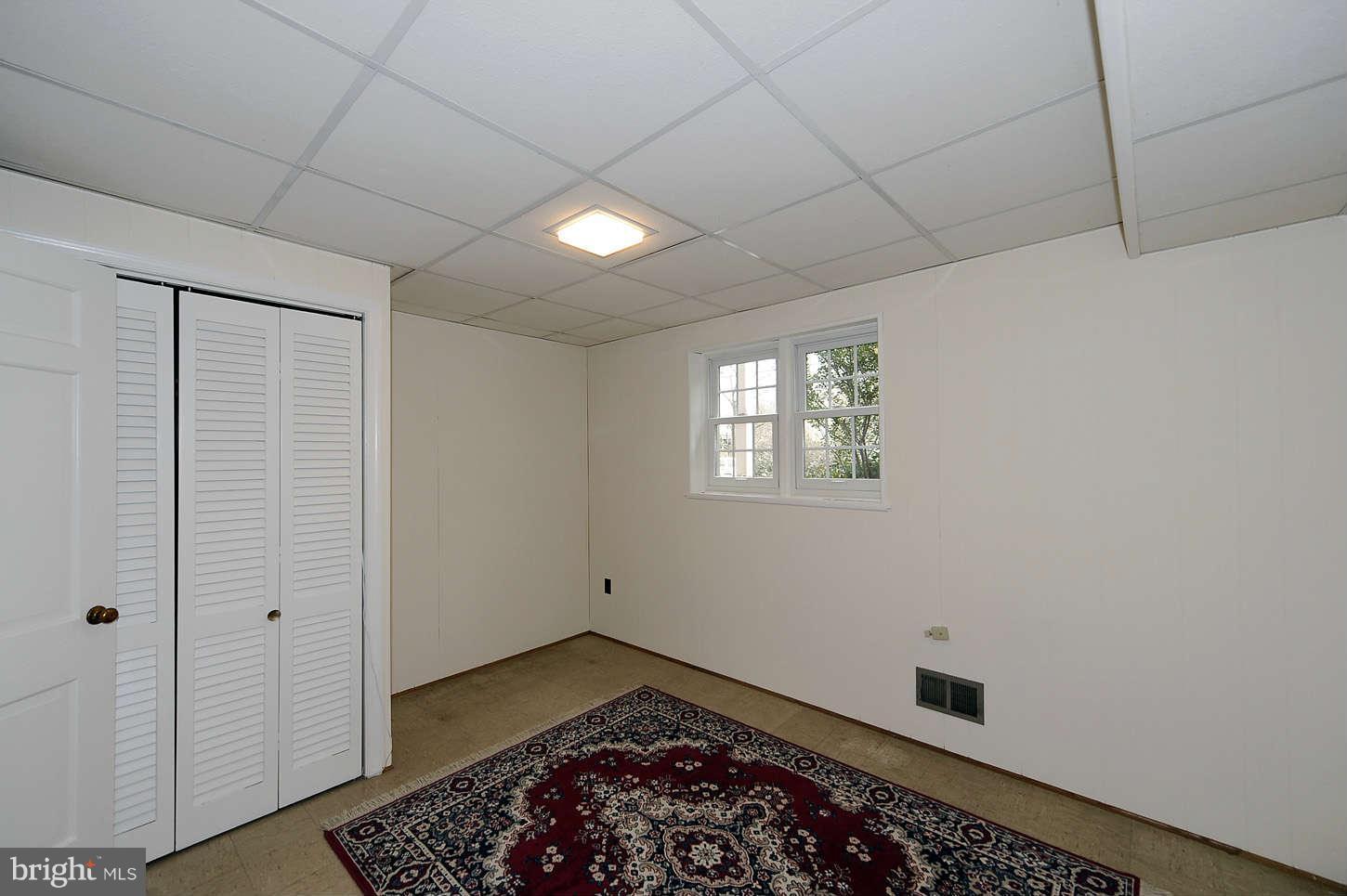 5719 Ogden Road Bethesda, MD 20816 - Photo 19 of 22 a view of an empty room with a window