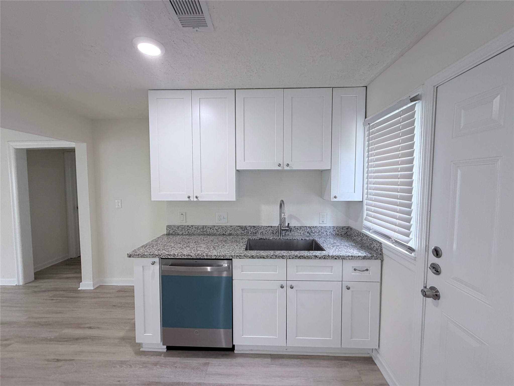 1112 3rd Street La Marque, TX 77568 - Photo 10 of 21 a kitchen with stainless steel appliances granite countertop a sink and a stove
