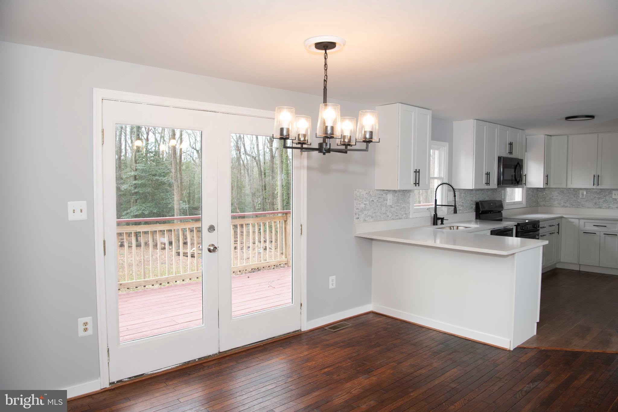 4785 Mountain Road Pasadena, MD 21122 - Photo 10 of 50 Bright kitchen with serene outdoor views.