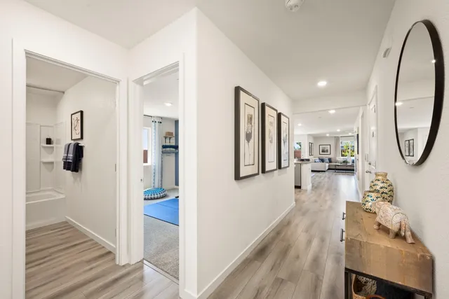 a living room with furniture and a mirror