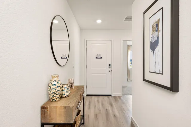 a view of a livingroom with furniture and entryway