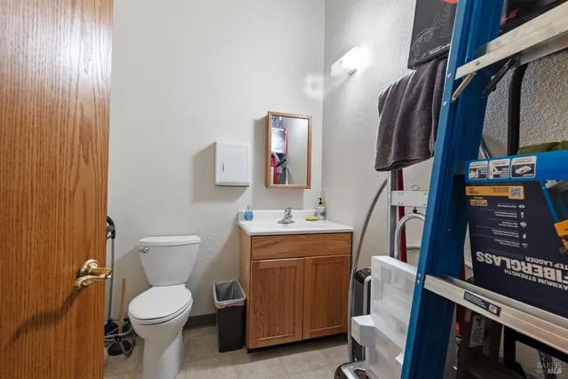 an aerial view of residential house with outdoor space and seating