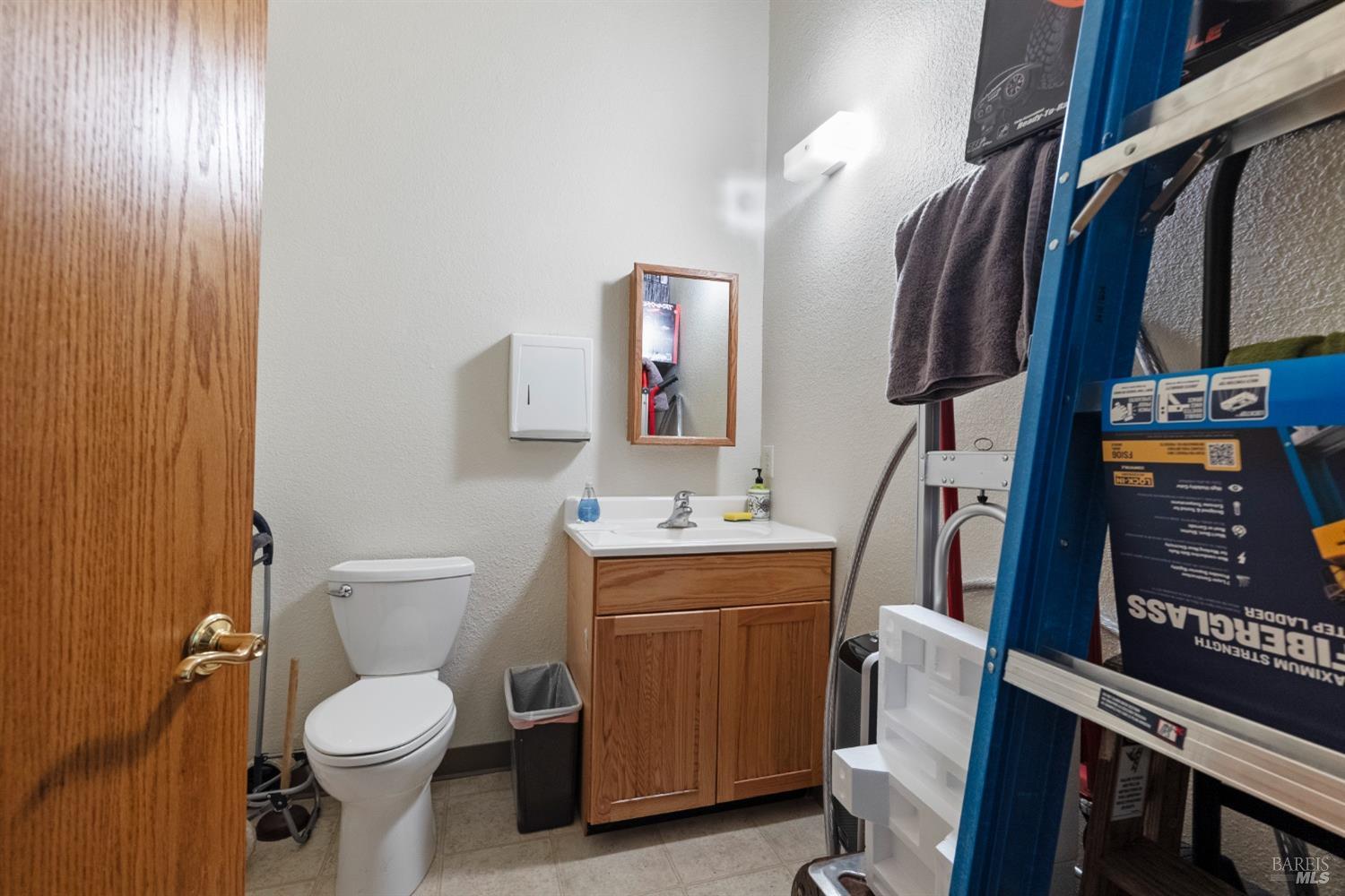 6650 Commerce Boulevard, Unit 17 Rohnert Park, CA 94928 - Photo 8 of 14 a bathroom with a toilet sink and mirror