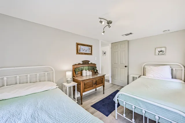 a bedroom with a bed and a dresser