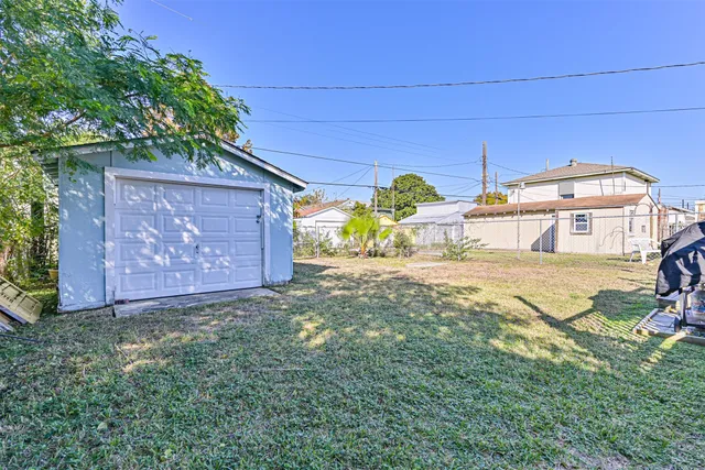 a view of a backyard of the house