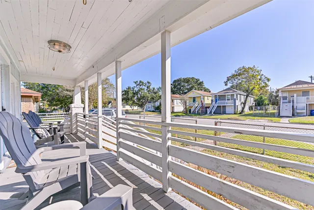 a view of a balcony with chairs