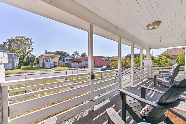 a view of a living room and balcony