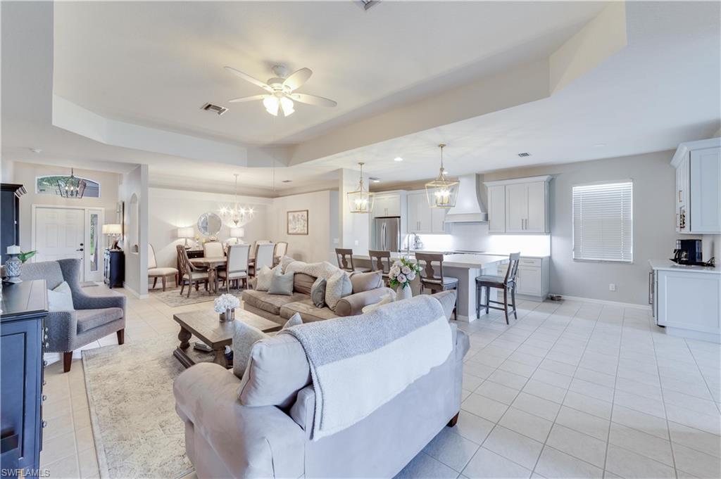 20599 Ardore Lane Estero, FL 33928 - Photo 14 of 34 a living room with furniture and a large window