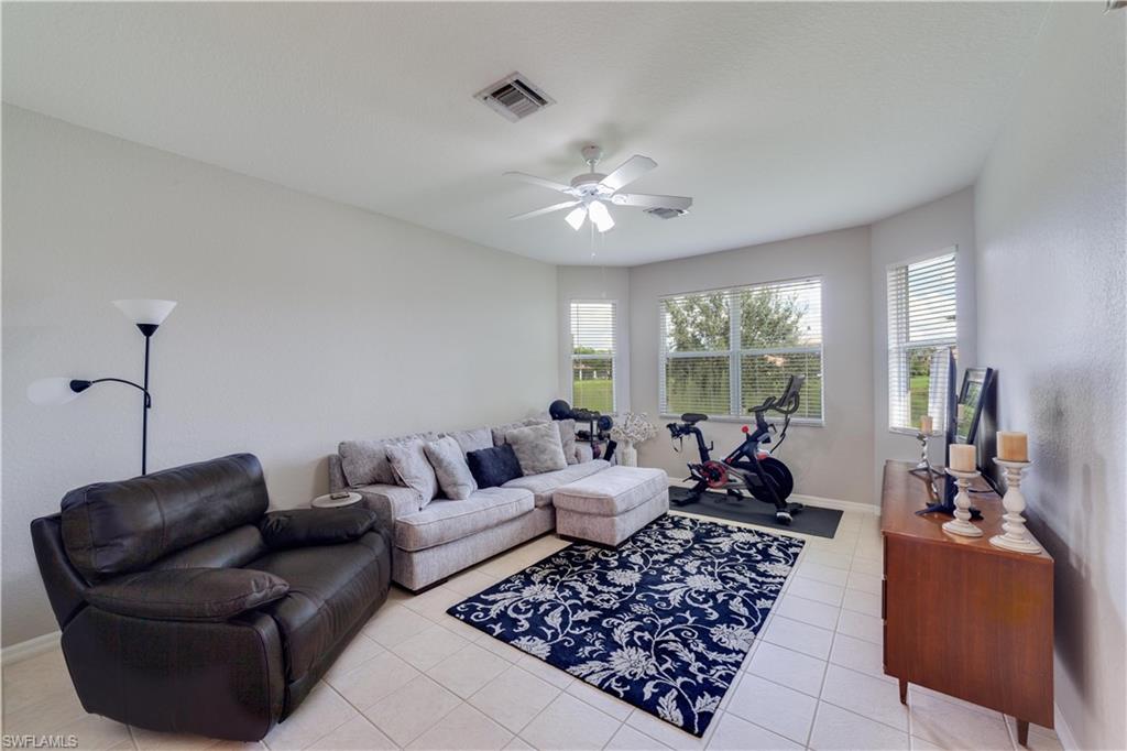 20599 Ardore Lane Estero, FL 33928 - Photo 18 of 34 a living room with furniture and a large window