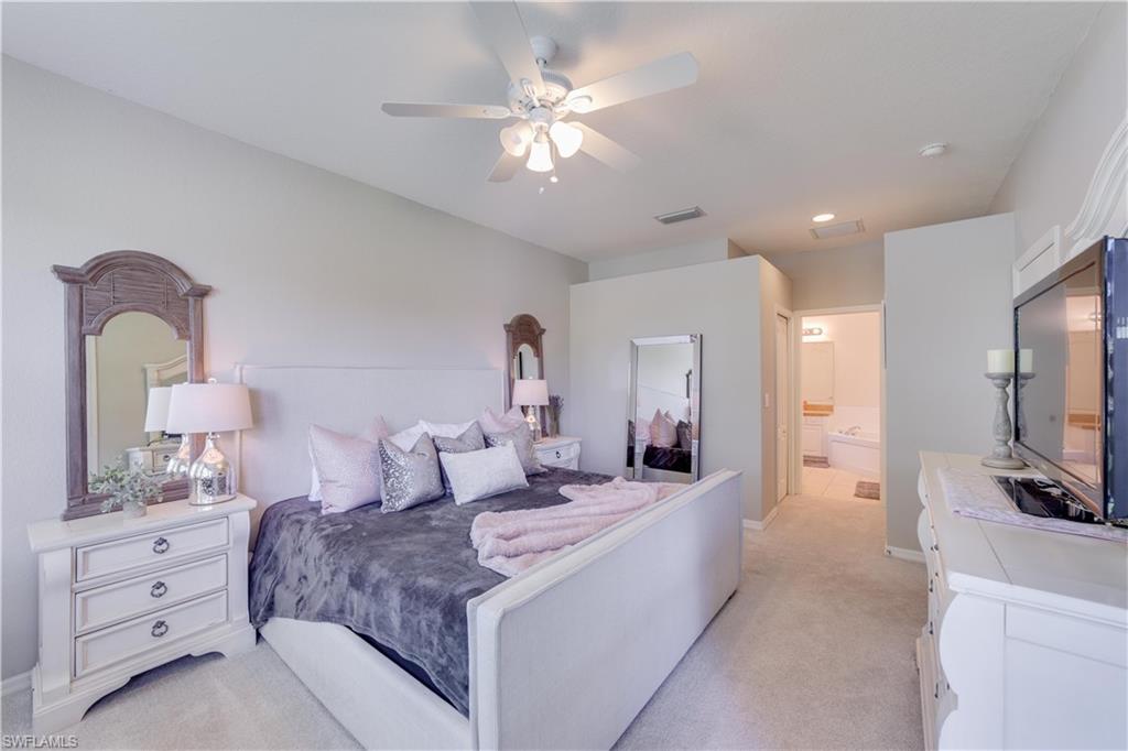 20599 Ardore Lane Estero, FL 33928 - Photo 20 of 34 a living room with furniture and a flat screen tv