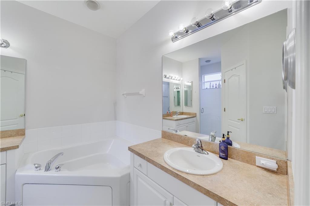 20599 Ardore Lane Estero, FL 33928 - Photo 25 of 34 a bathroom with a sink and a mirror