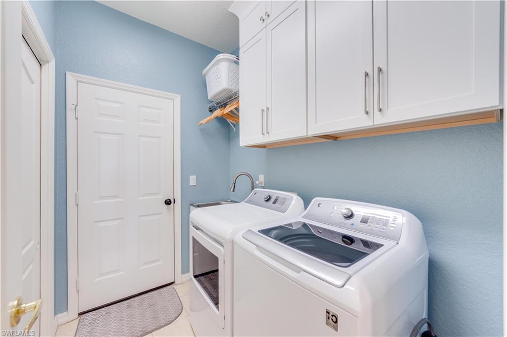 20599 Ardore Lane Estero, FL 33928 - Photo 30 of 34 a utility room with dryer and washer