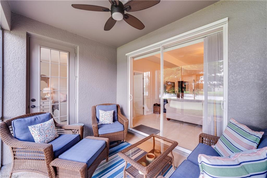 20599 Ardore Lane Estero, FL 33928 - Photo 32 of 34 a living room with furniture and a large window