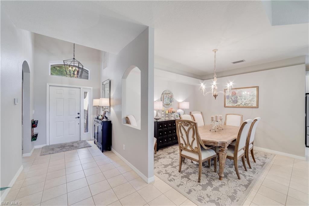20599 Ardore Lane Estero, FL 33928 - Photo 10 of 34 a view of a dining room with furniture