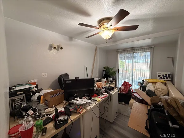 a view of an empty room with glass door