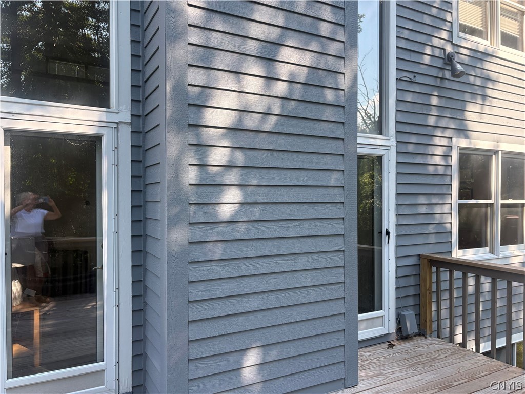 4627 Reliant Road Onondaga, NY 13078 - Photo 5 of 39 Living room doors lead to sunny, west facing deck