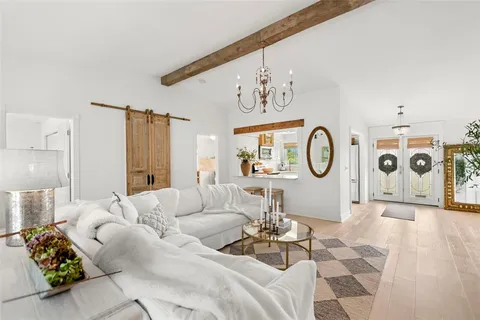 a view of a chairs and table in the balcony