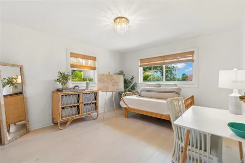 a view of staircase with white walls and a window