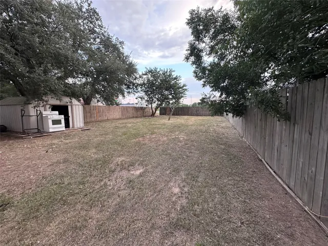 a view of a backyard of the house