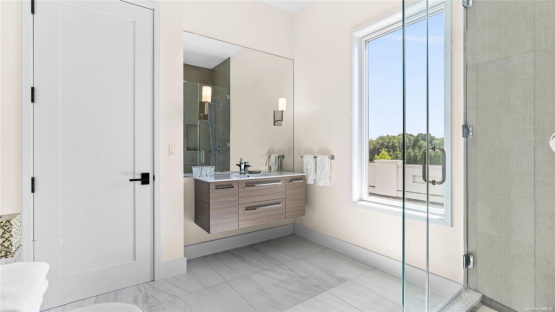 Undisclosed Address Southampton, NY 11968 - Photo 11 of 12 a bathroom with a double vanity sink and mirror with shower