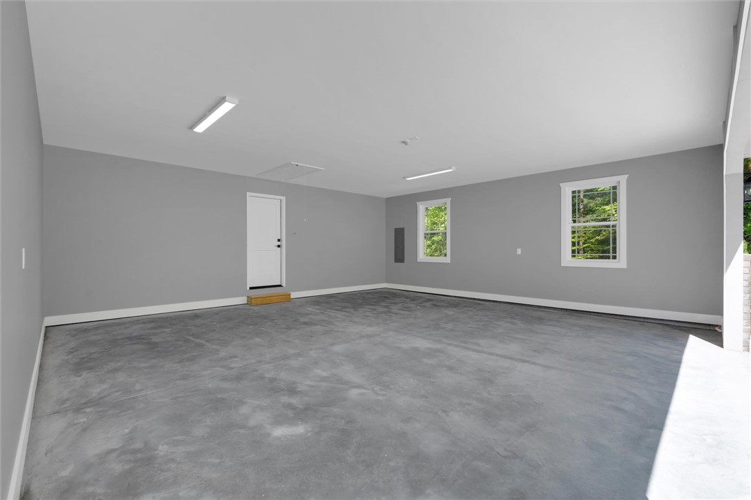 1747 A State Rd S-4-97 Anderson, SC 29621 - Photo 34 of 47 Ample space for vehicles or a workshop, this bright garage offers convenient access and natural light.