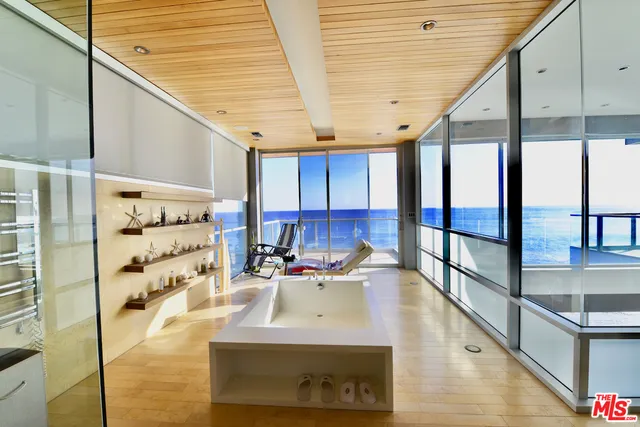 a kitchen with stainless steel appliances kitchen island granite countertop a sink and cabinets