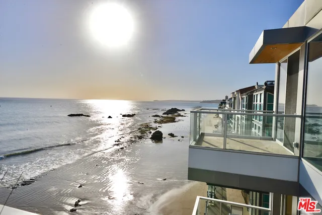 a view of balcony with wooden floor