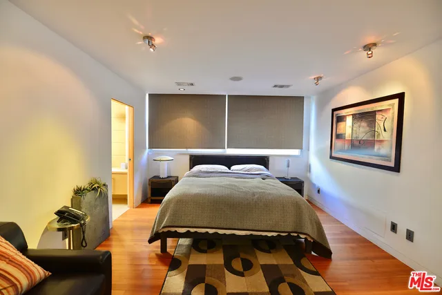 a room with a bed and a table in it