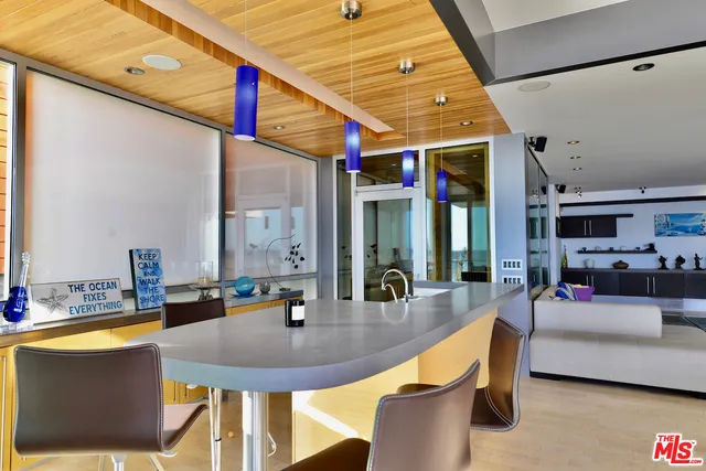 a view of an entryway with table and chairs