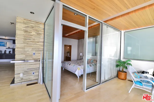 a view of a balcony with chair and table