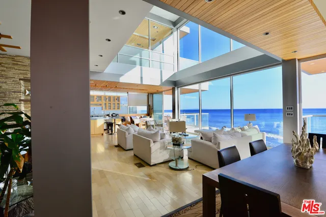 a room with lots of furniture and chandelier