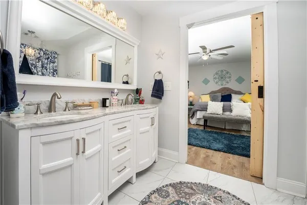 a bathroom with a sink and a mirror