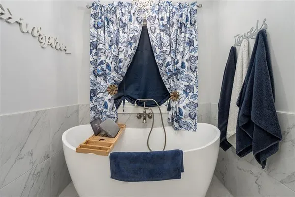 a utility room with closet dryer and washer
