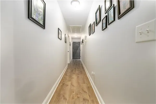a bathroom with a toilet a sink and a mirror