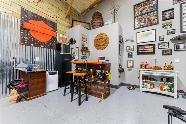 a view of a room with lots of stuff and furniture
