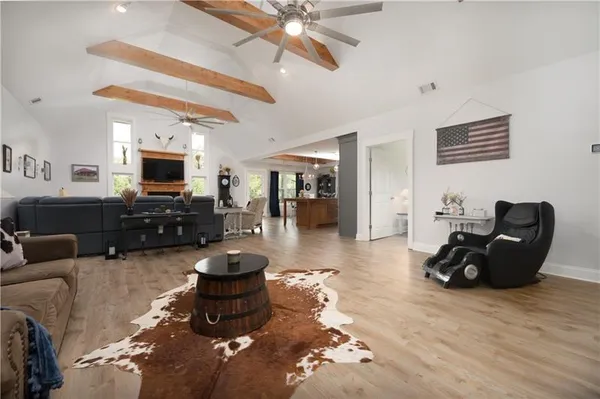 a living room with furniture window and a fireplace