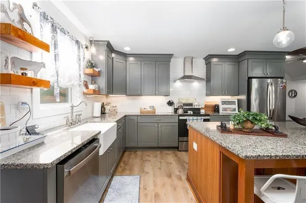 a kitchen with a counter space cabinets and appliances