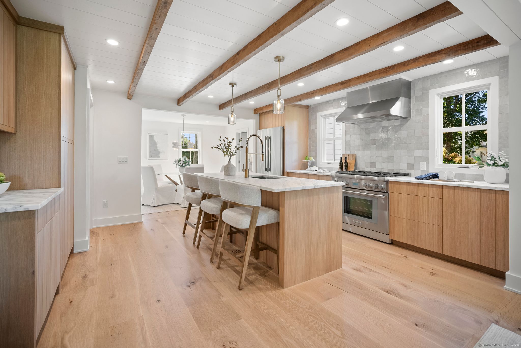 a large kitchen with lots of counter space a sink and appliances