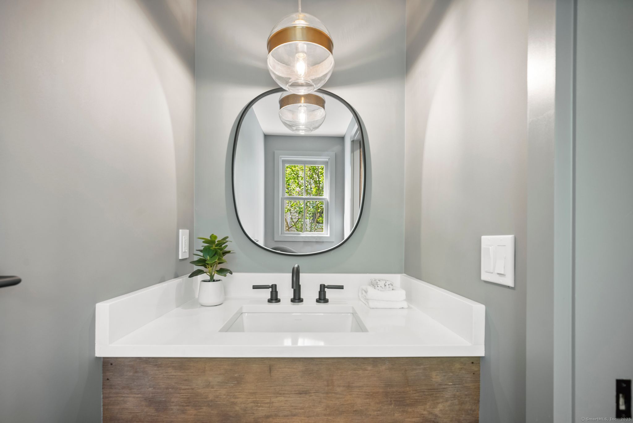 7 Wild Rose Road Westport, CT 06880 - Photo 13 of 33 a bathroom with a sink and a mirror