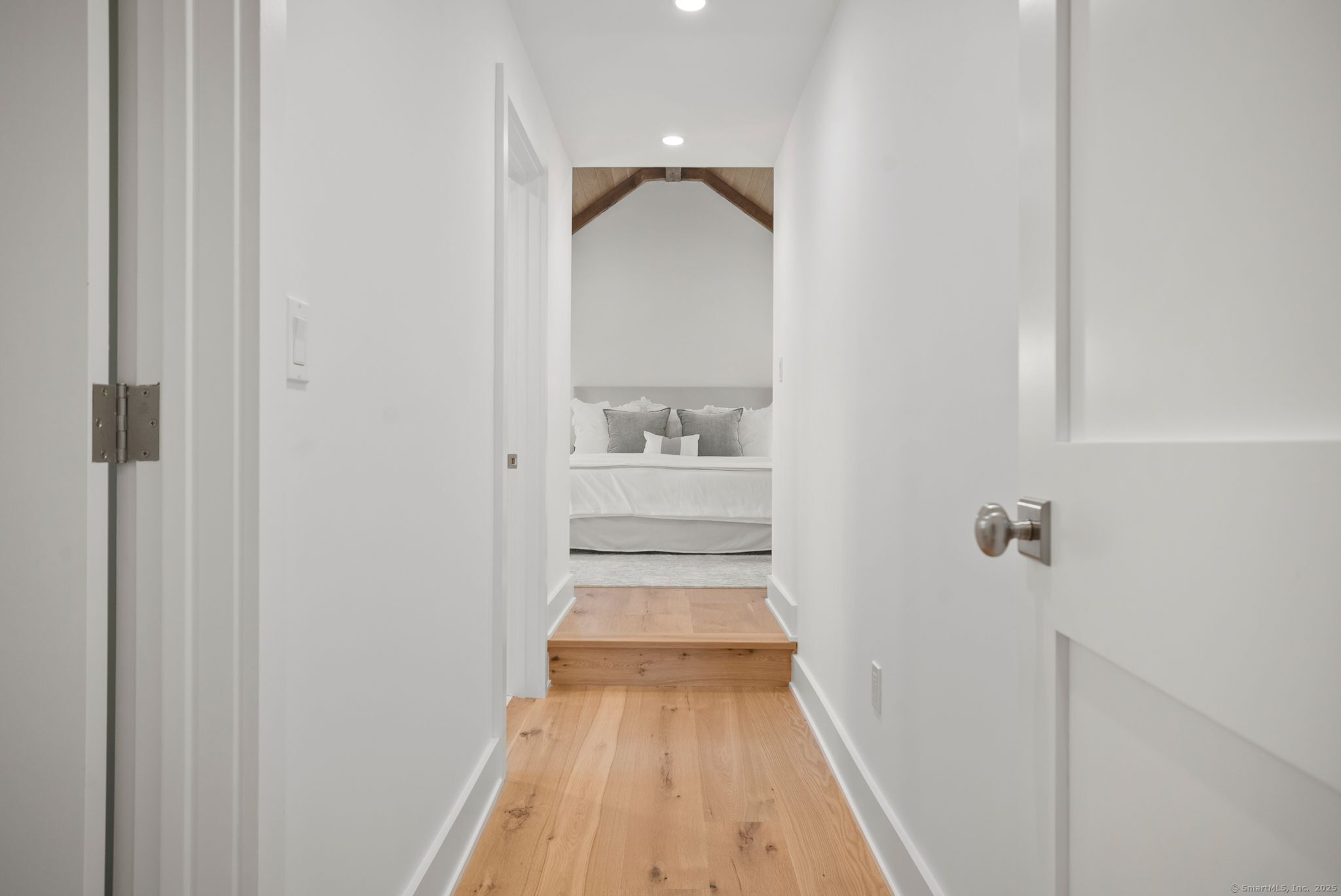 7 Wild Rose Road Westport, CT 06880 - Photo 15 of 33 a view of a hallway with wooden floor and a bathroom