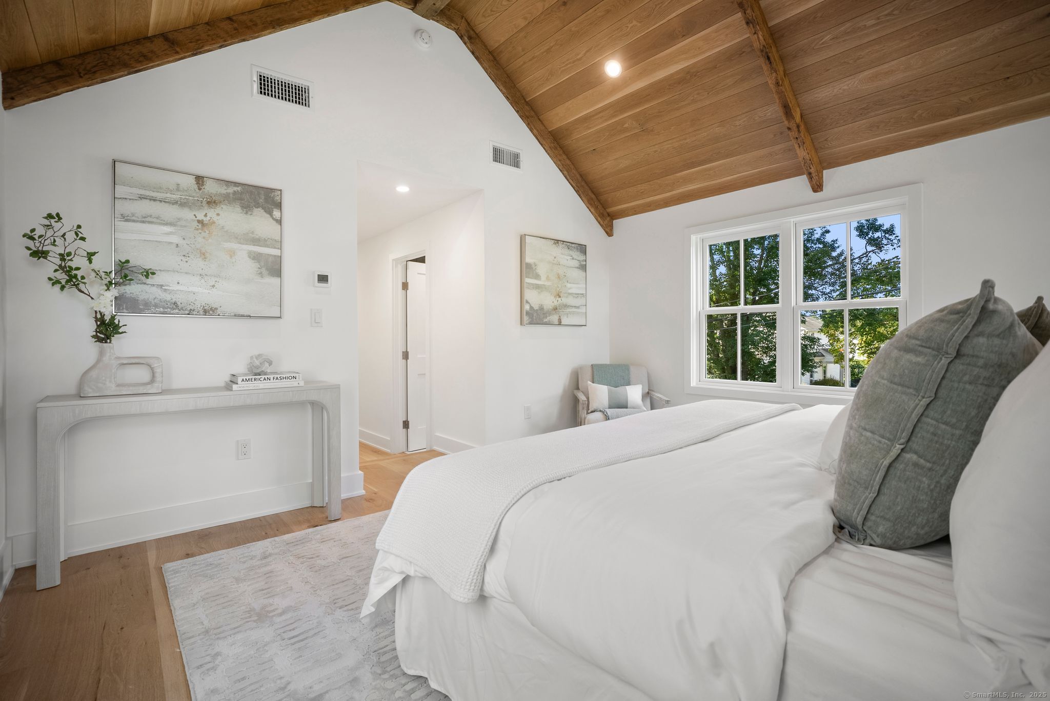 7 Wild Rose Road Westport, CT 06880 - Photo 17 of 33 a bed room with a bed and a window