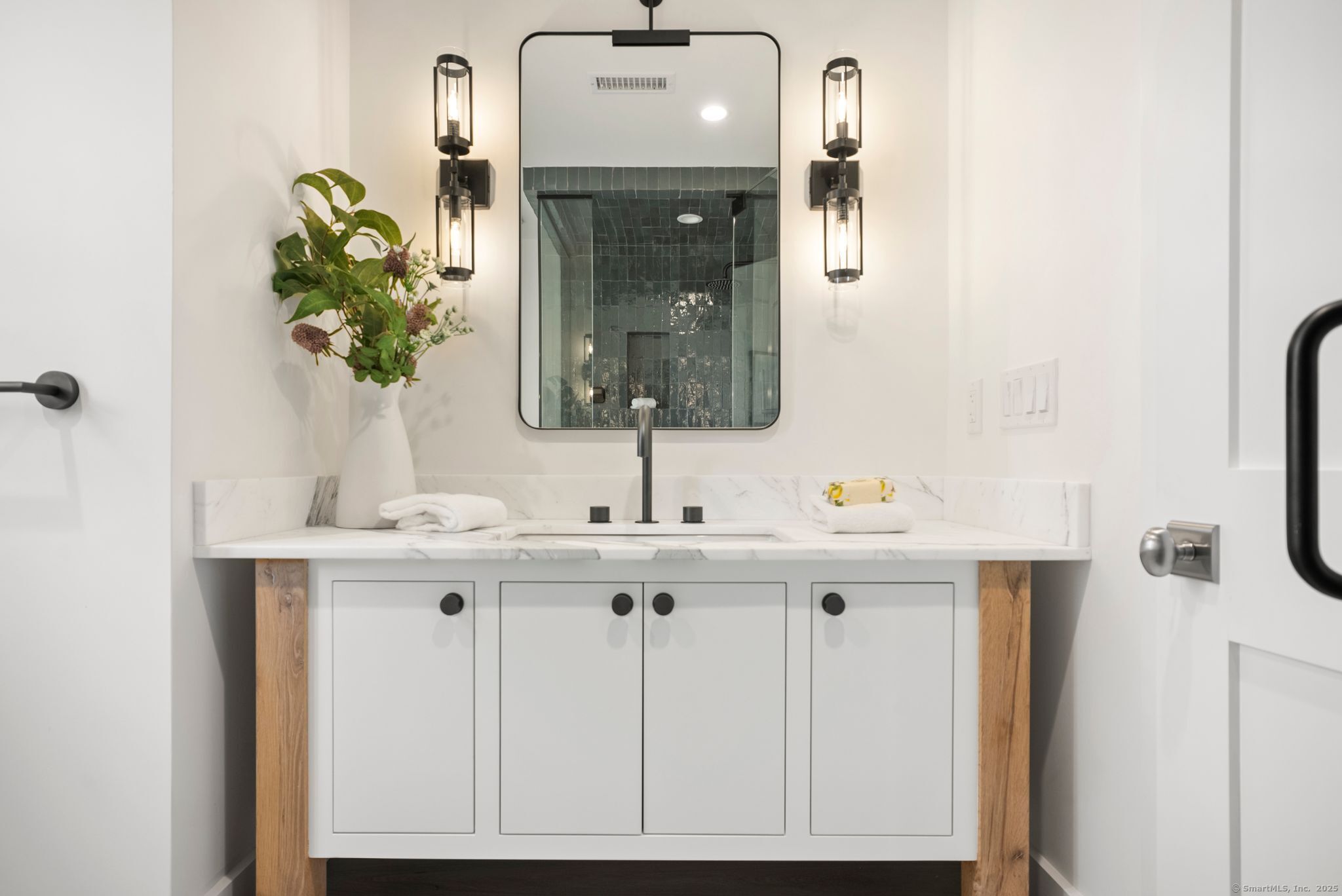 7 Wild Rose Road Westport, CT 06880 - Photo 18 of 33 a bathroom with a sink a potted plant and a mirror