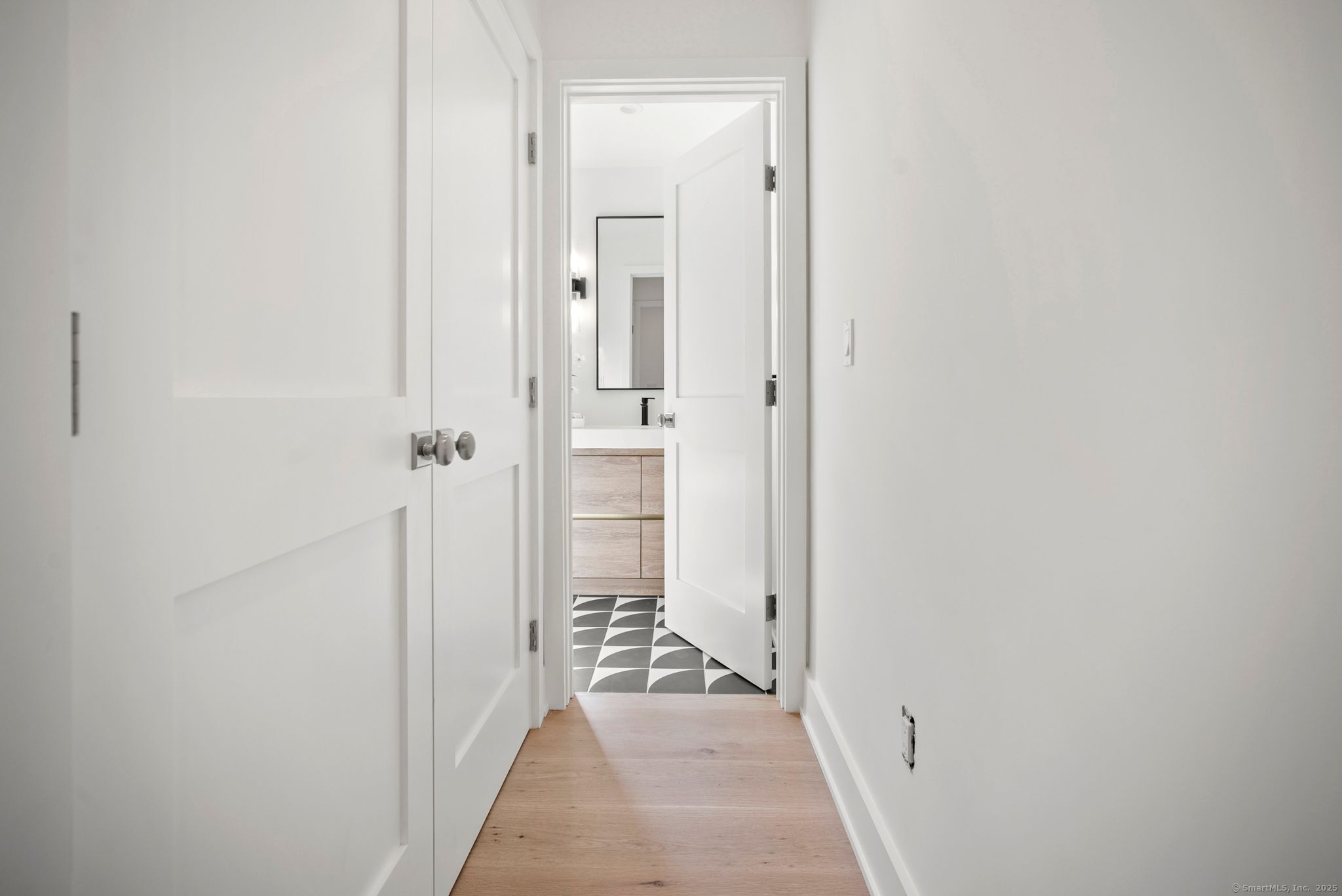 7 Wild Rose Road Westport, CT 06880 - Photo 23 of 33 a hallway with a hardwood floor