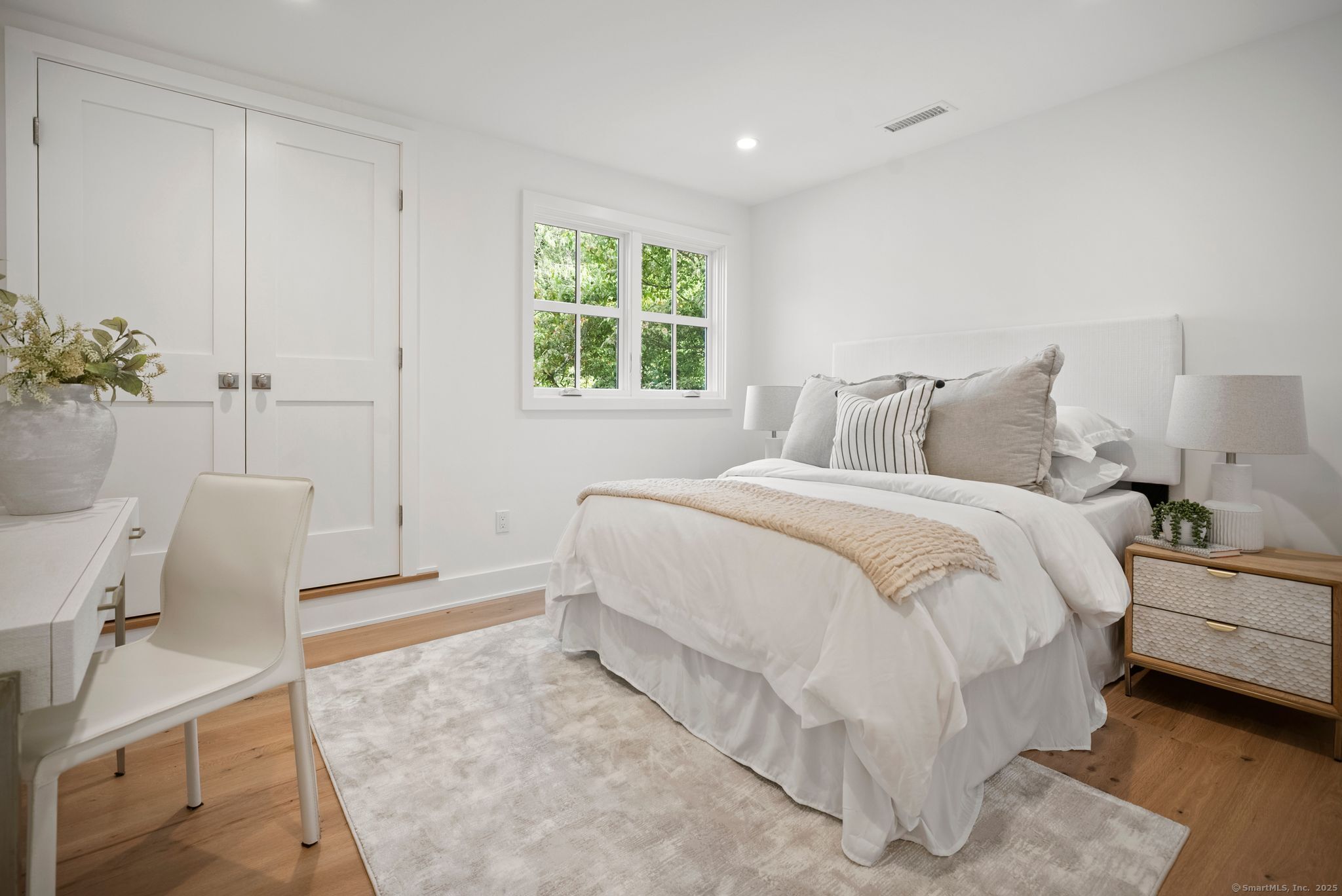 7 Wild Rose Road Westport, CT 06880 - Photo 25 of 33 a bed room with a bed and a chair