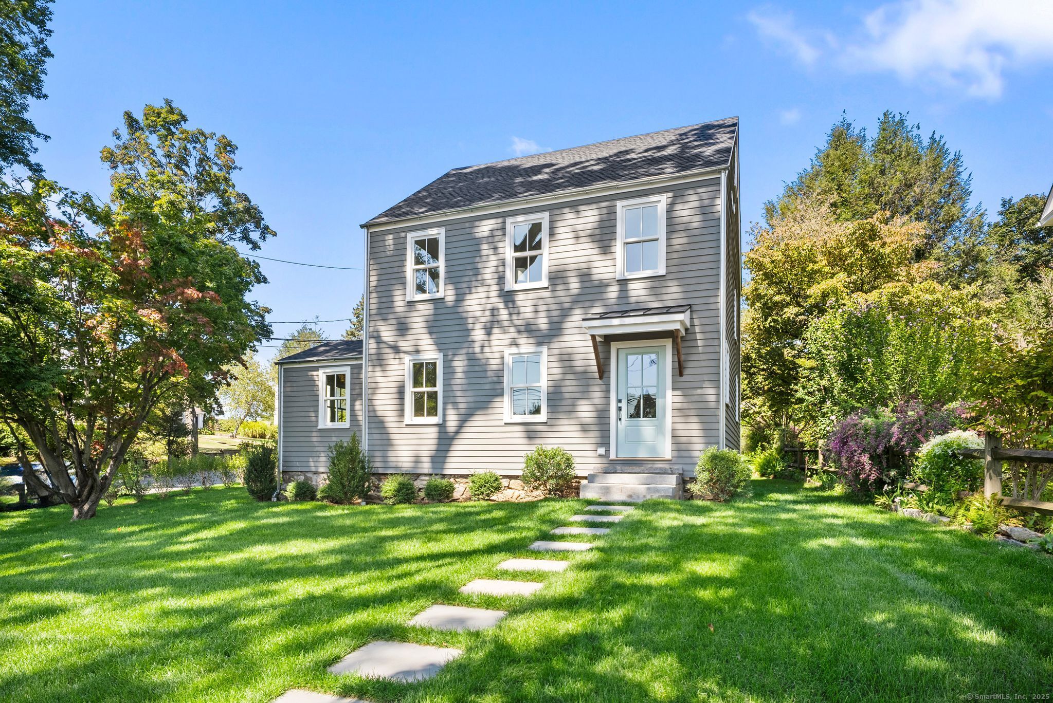 7 Wild Rose Road Westport, CT 06880 - Photo 26 of 33 a front view of a house with a yard