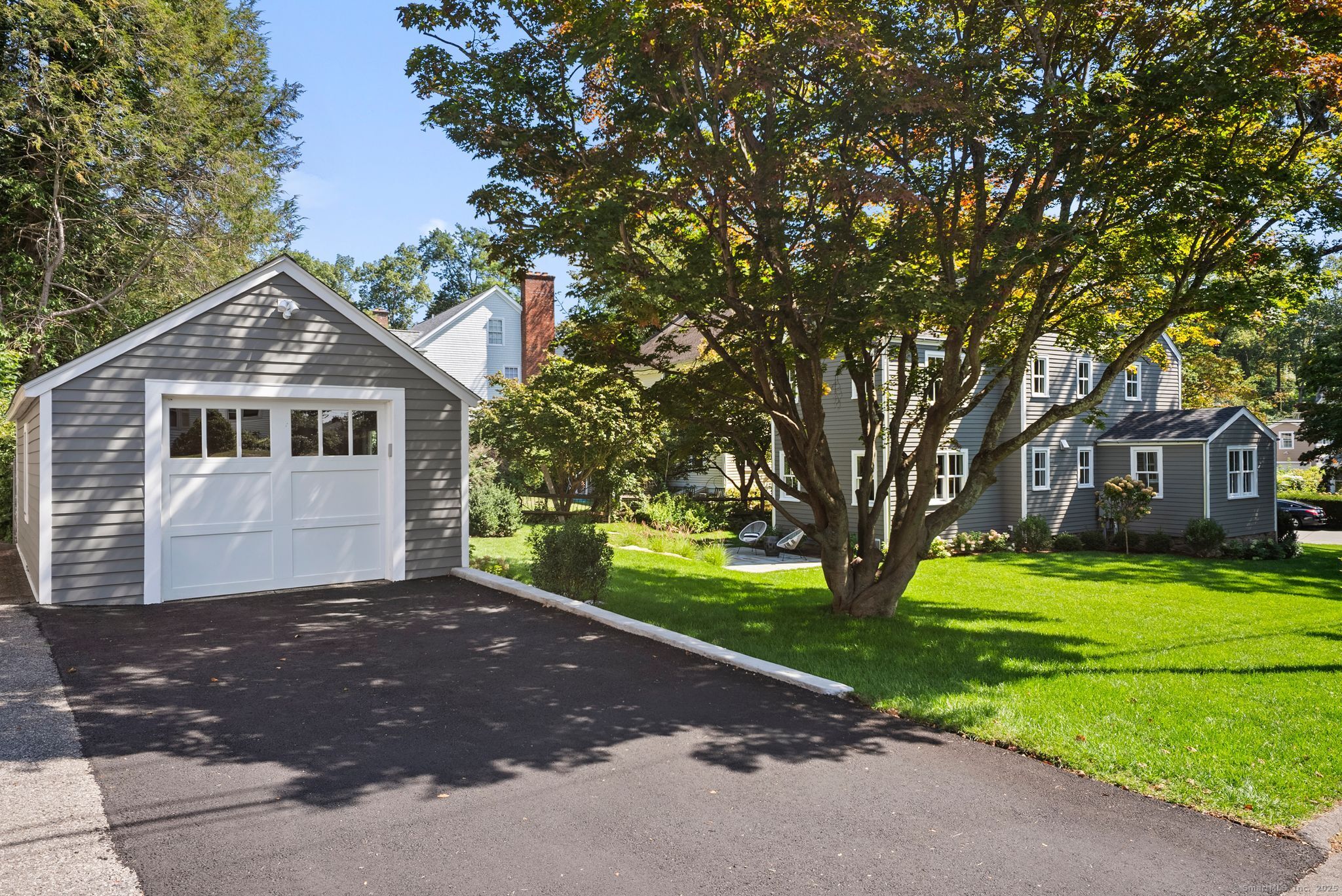 7 Wild Rose Road Westport, CT 06880 - Photo 28 of 33 a front view of a house with a yard