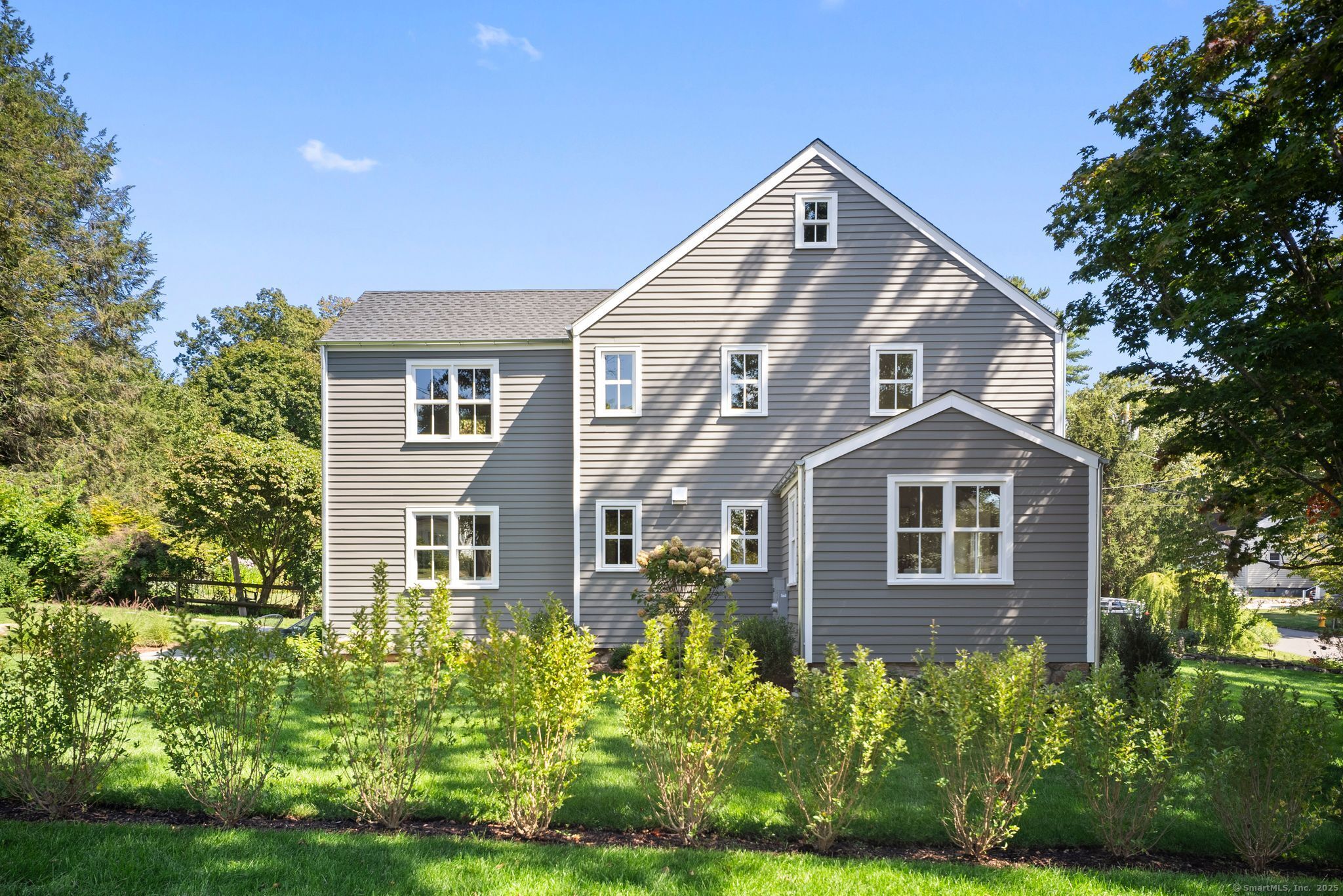 7 Wild Rose Road Westport, CT 06880 - Photo 29 of 33 a front view of a house with a yard
