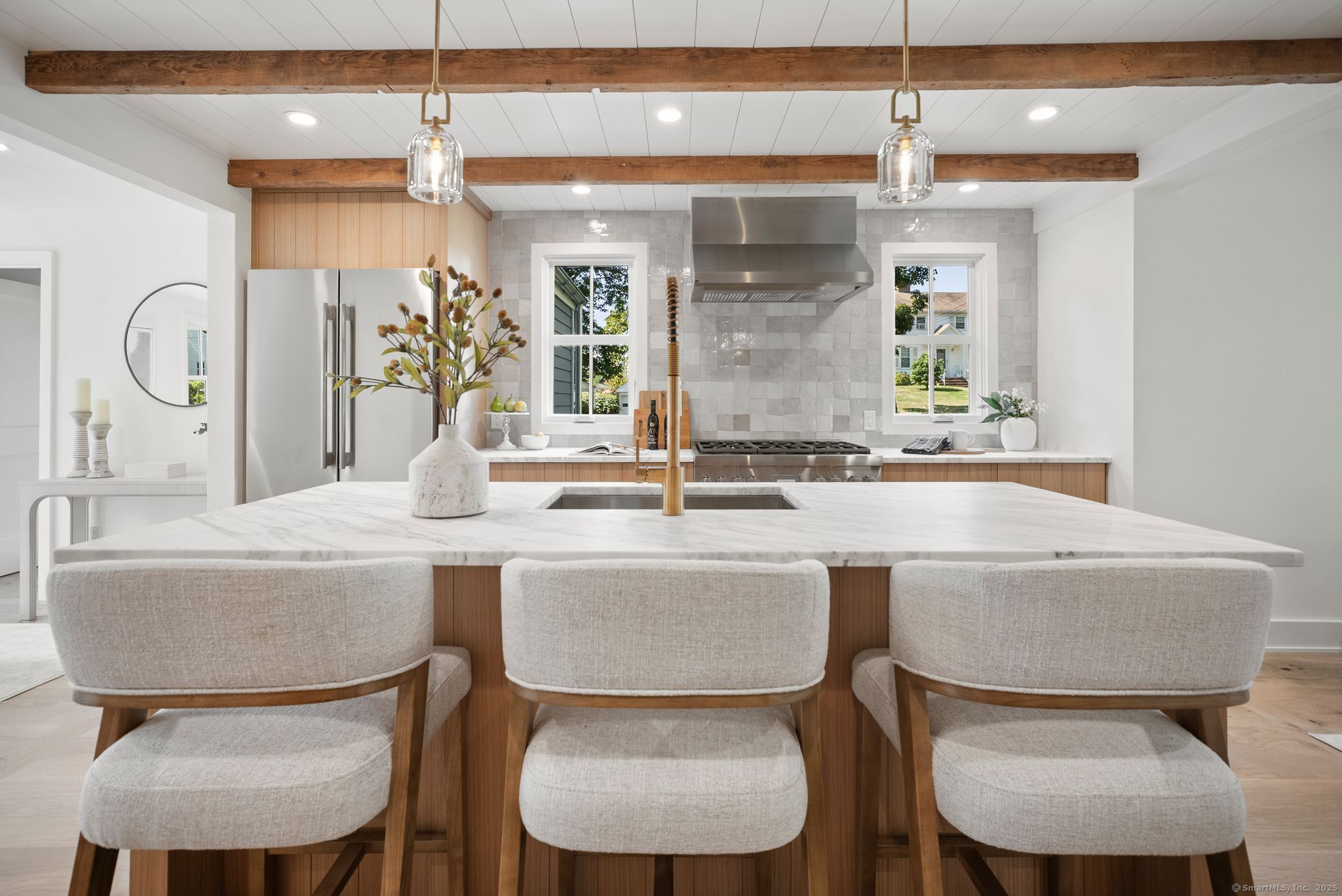7 Wild Rose Road Westport, CT 06880 - Photo 6 of 33 a kitchen with a table chairs stove and wooden floor