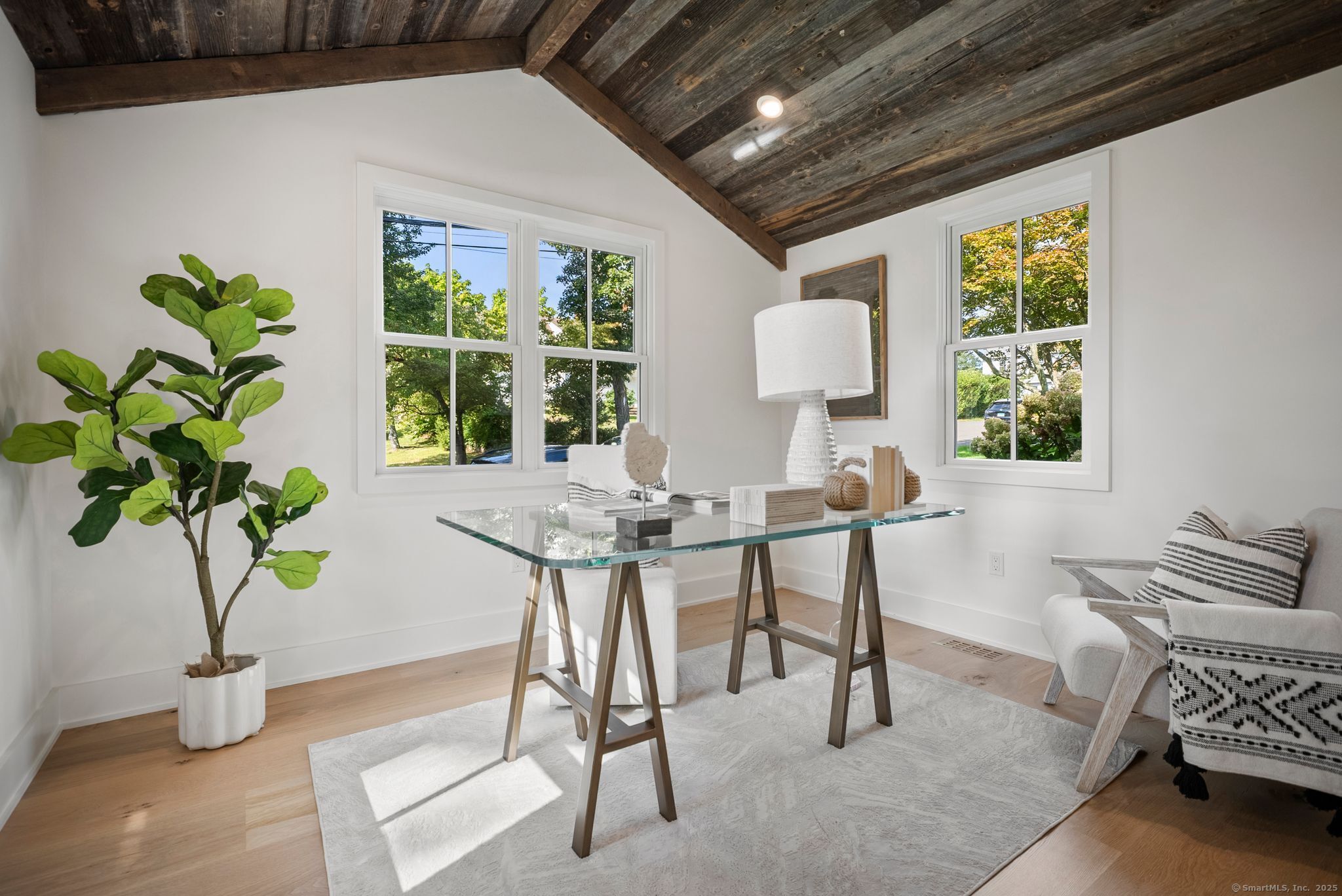 7 Wild Rose Road Westport, CT 06880 - Photo 10 of 33 a workspace with furniture and a potted plant