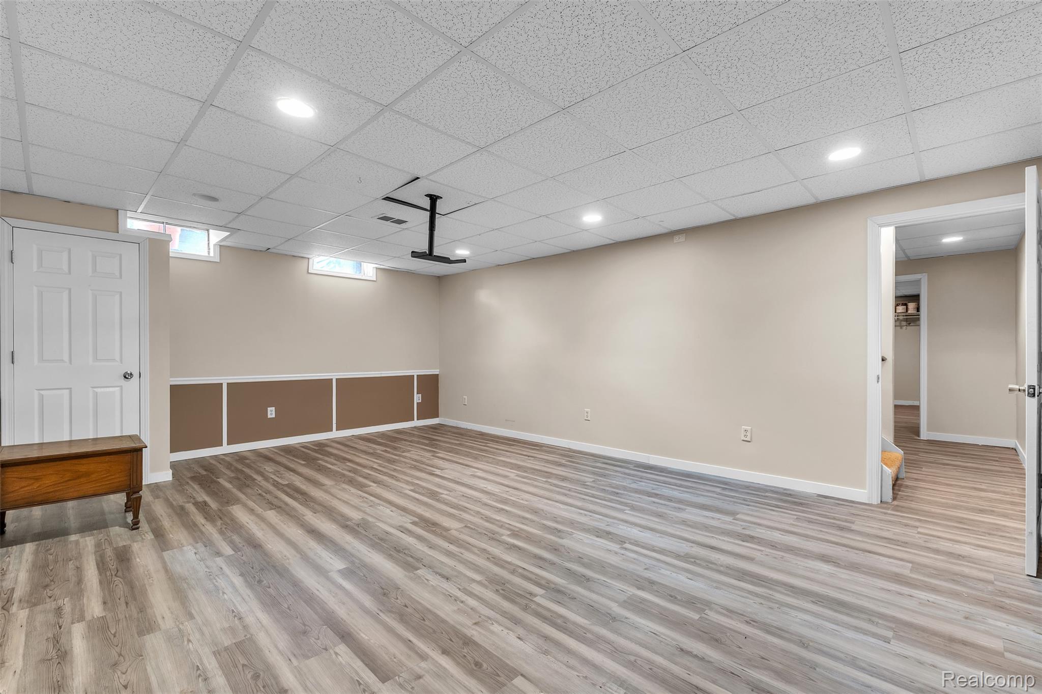 1345 Ives Road Mason, MI 48854 - Photo 38 of 92 Below grade area with a paneled ceiling, light wood-type flooring, and recessed lighting